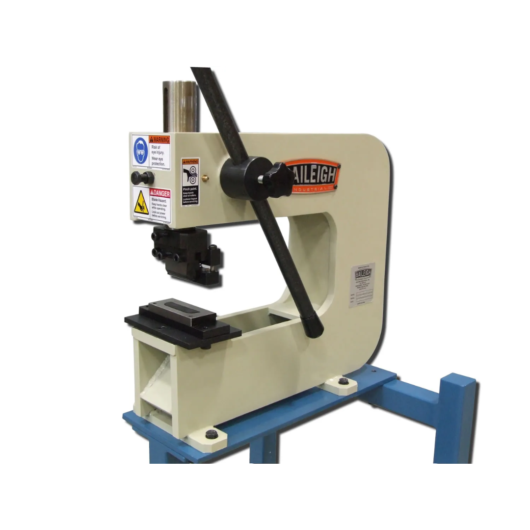 Angled view of Baileigh Metal Bench Press - BP-3 1000792 showing precision lever-operated press mechanism, adjustable tooling area, and industrial-grade construction for metalworking applications.