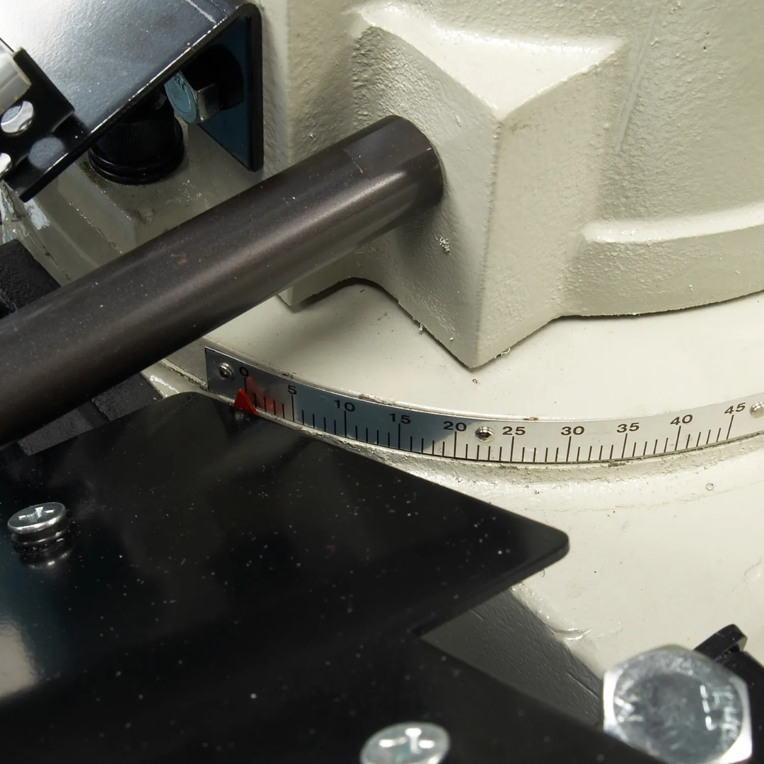 Baileigh 7-Inch Horizontal/Vertical Bandsaw, Coolant Pump (BS-712MS) 1001684 blade and guide assembly close-up showing precision cutting components and adjustable metalworking features.