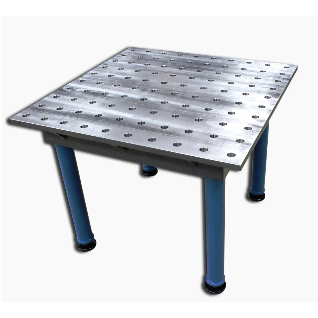 Baileigh Welding Jig Table WJT-3939 1010424 shown in an angled front view, featuring a precision-machined steel tabletop with a grid of fixture holes, heavy-duty welded frame, adjustable leveling feet, and rigid construction for accurate welding, fabrication, and fixturing applications.