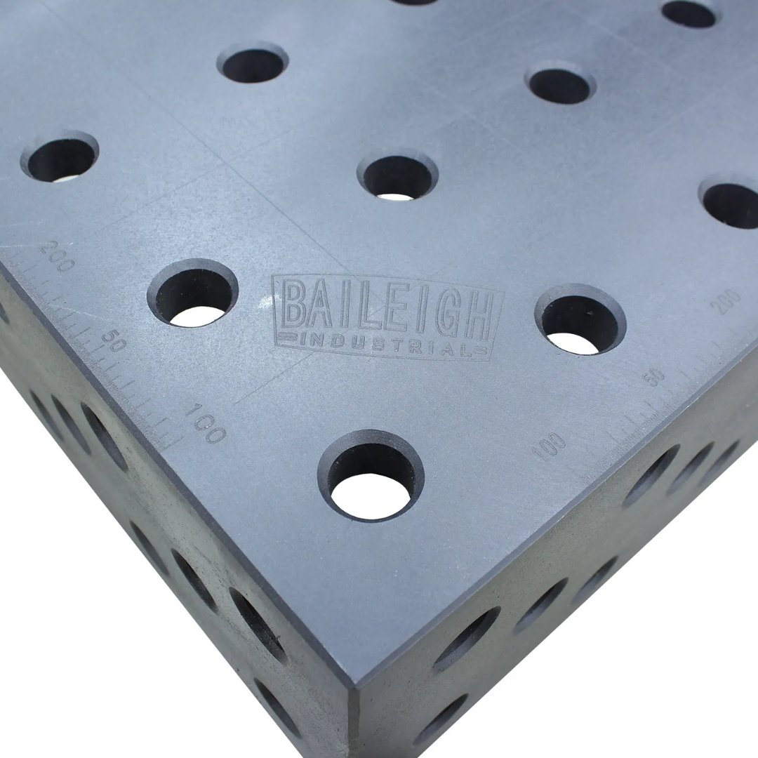 Baileigh Welding Jig Table WJT-7839-HD 1010426 tabletop corner close-up highlighting the precision-machined 28 mm fixturing hole pattern and durable cast iron surface for accurate clamping and repeatable welding setups.