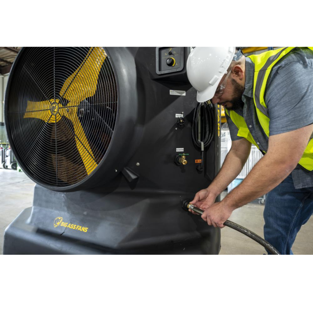 Big Ass Fans Cool-Space 400 Evaporative Cooler E-400-3601 technician adjusting portable evaporative cooling fan in industrial facility