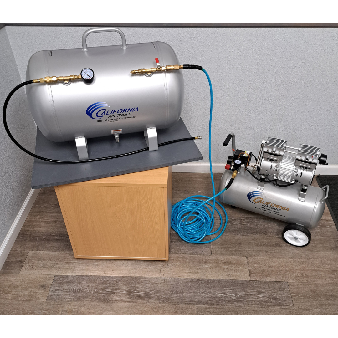 California Air Tools AUX05S 5.0 Gallon Steel Portable Auxiliary Air Tank setup on box demonstrating portable usage