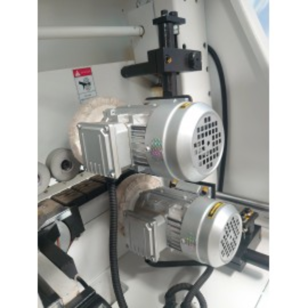 Close-up of industrial glue pot and application system inside the Castaly EB-M8PMCR edge bander.