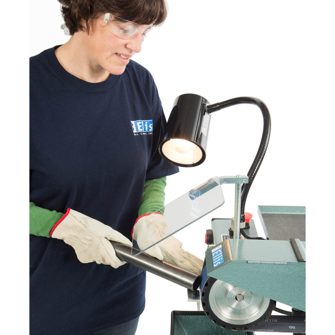 Close-upofEllisbeltgrinderinusewithclearsafetyshield