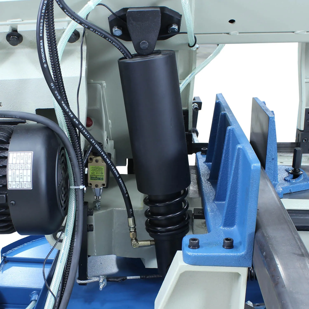 Detailed view of the hydraulic cylinder and saw head support on the Baileigh Metal Cutting Bandsaw - BS-330M 1001517 illustrating the controlled feed system and robust industrial construction.