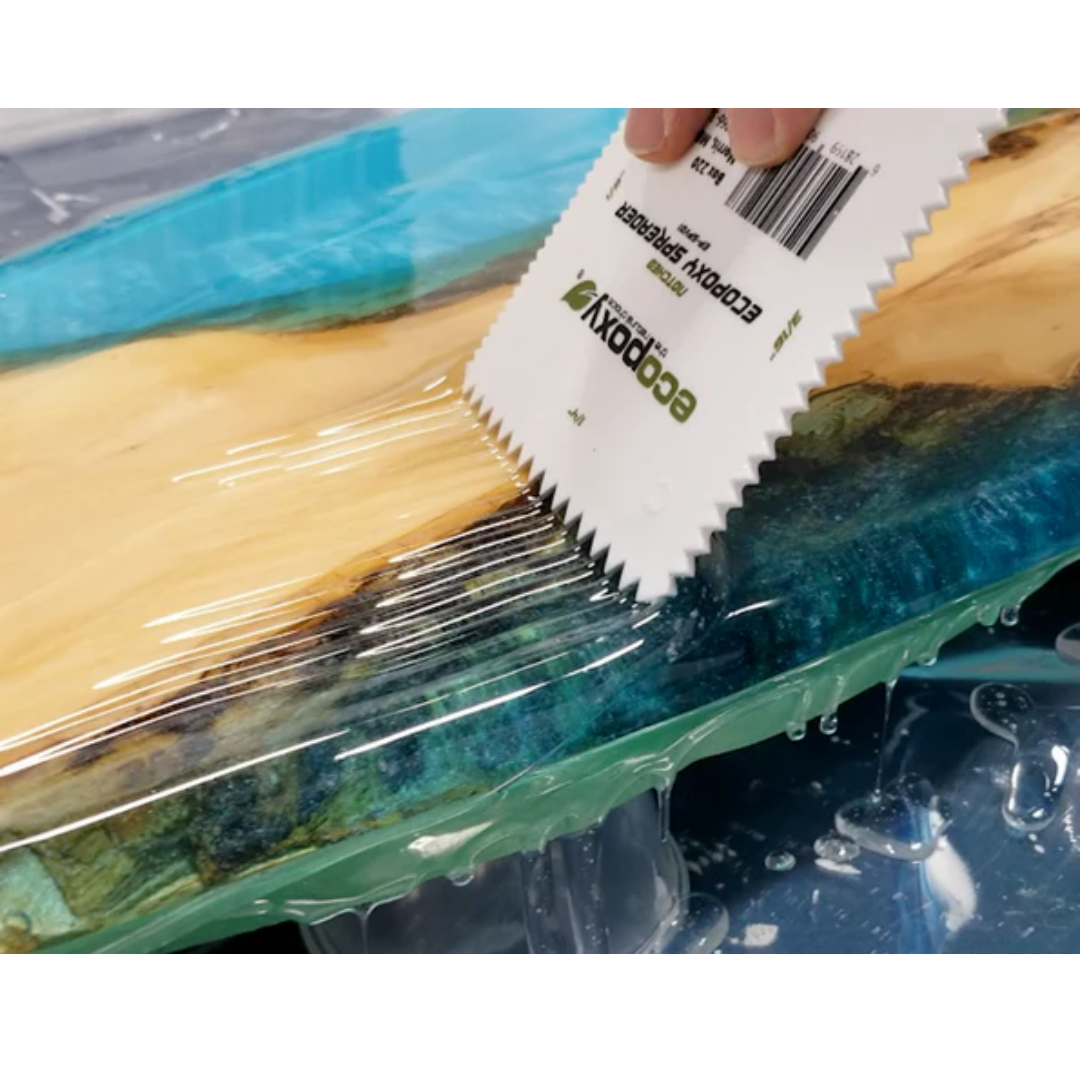 Ecopoxy V-Notched EcoPoxy Spreader (Pack of 36) EP-SPV01-36X applying epoxy resin along wood grain surface for controlled flow and consistent coverage