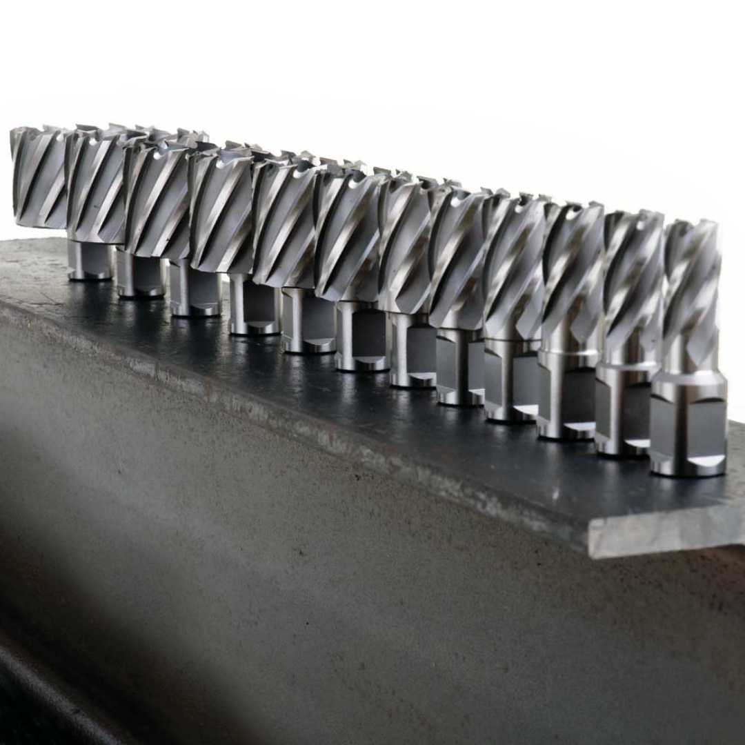 Evolution Power Tools Annular HSS Cutter CC275L installed in a magnetic drill producing multiple clean, precision holes in steel, demonstrating efficient chip evacuation and consistent cutting performance.