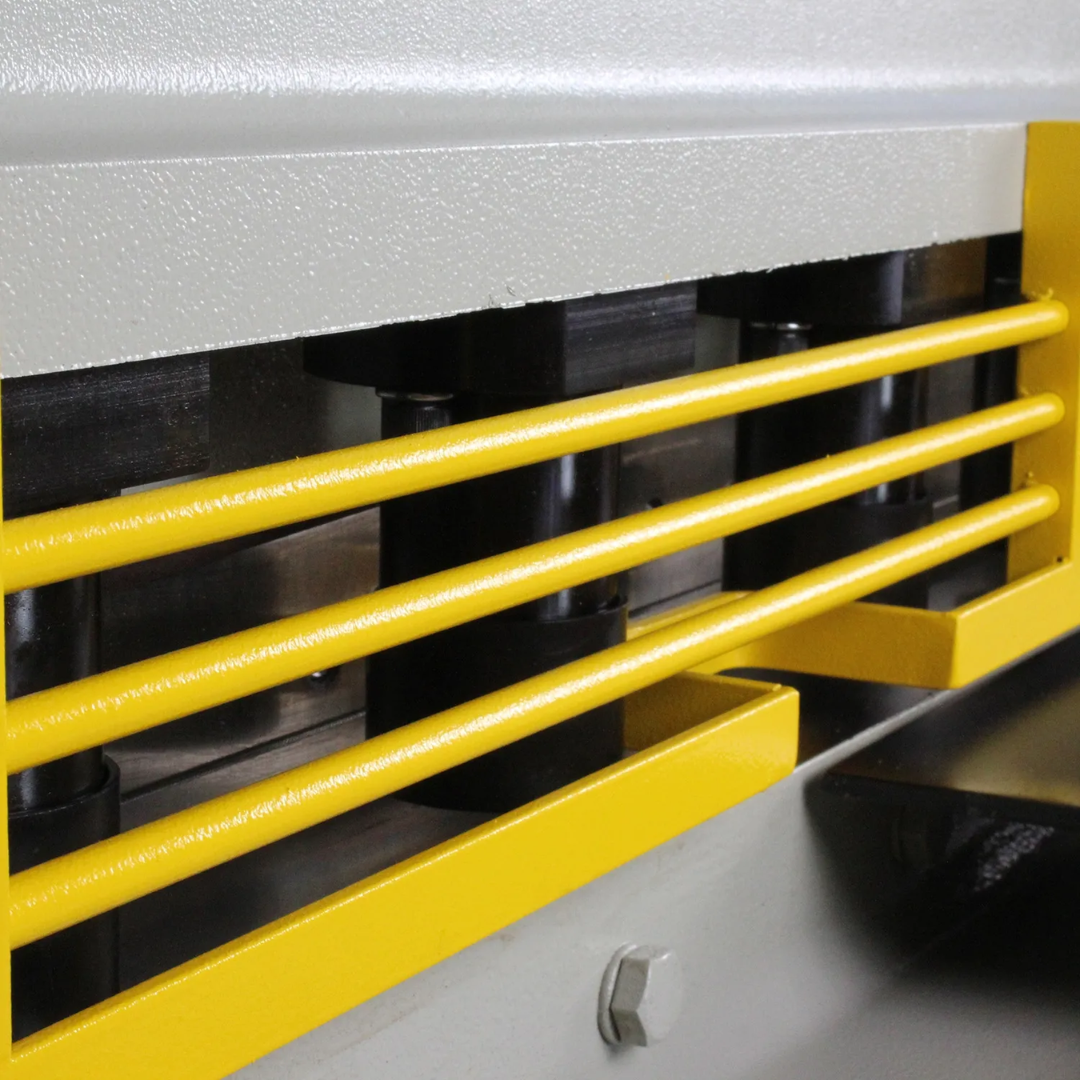 Front safety guard and cutting zone of Baileigh 52-Inch Heavy-Duty Hydraulic Sheet Metal Shear SH-5210-HD 1007122 designed to enhance operator safety and visibility during cutting tasks.