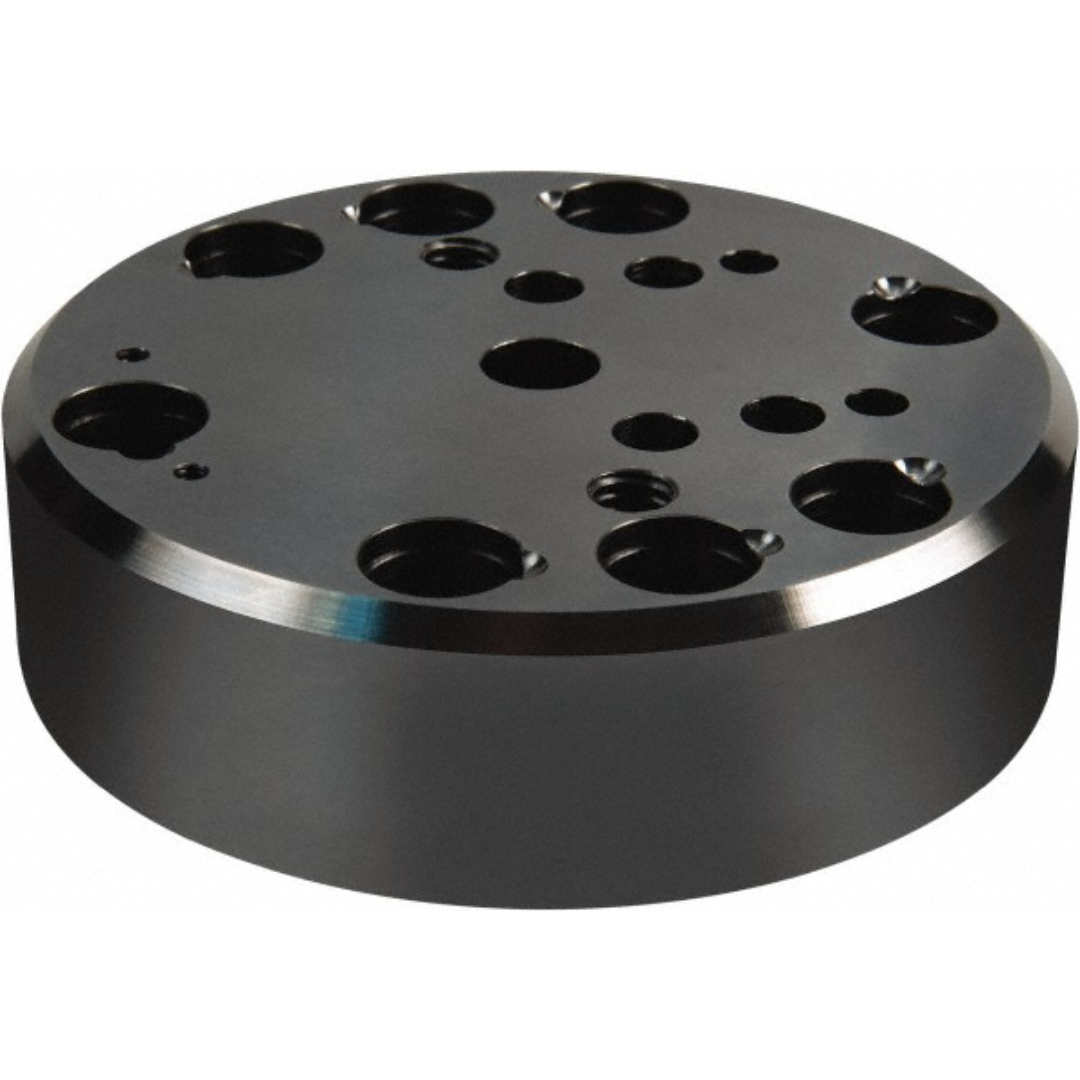 Kurt Vise Jaw Accessory: Riser DT20-1 precision-machined circular riser featuring multiple mounting and locating holes, designed to elevate and support Kurt DoveLock workholding systems for enhanced machining accessibility.