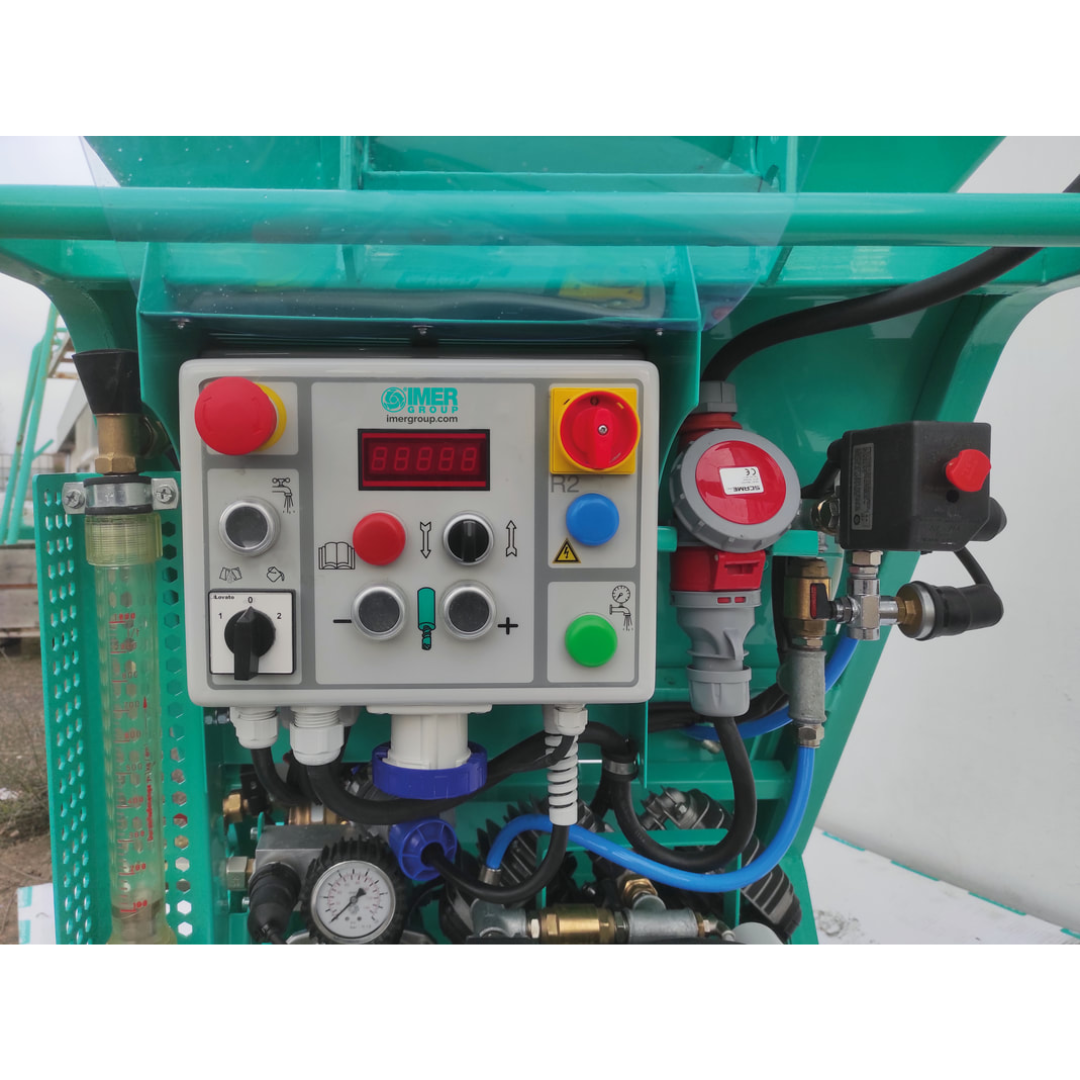 MER KOINE 3.1 Continuous Mixer/Pump control panel close-up with integrated operational switches, safety controls, and performance management interface for construction applications.