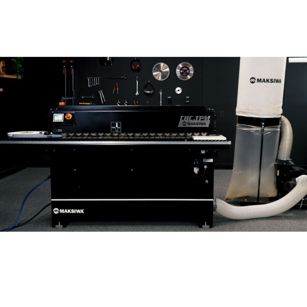 Maksiwa CP/2.C Dust Collector installed beside cabinet shop equipment with hose connected for extraction