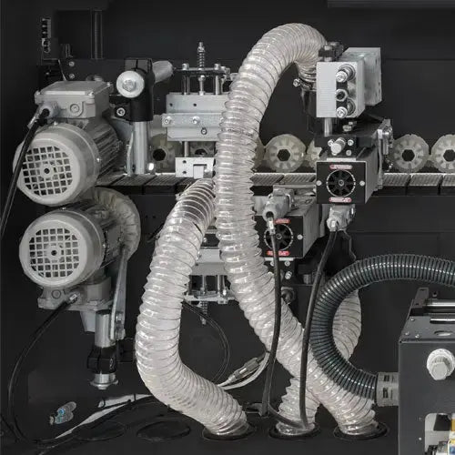 Maksiwa Edgebander CBC.TPM - Pre-Milling feed mechanism close-up showing gears, belts, and drive components