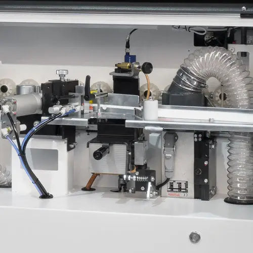 Maksiwa Edgebander CBC.TPM - Pre-Milling internal processing area showing trimming and feed system components