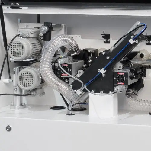 Maksiwa Edgebander CBC.TPM - Pre-Milling internal station close-up showing rollers and mechanical components