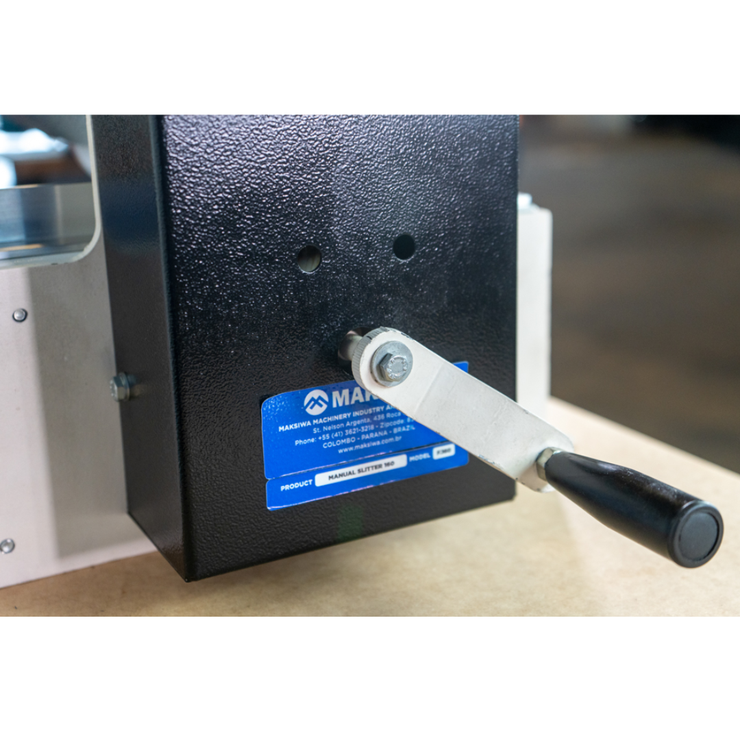 Maksiwa F.160 manual slitter side view with manual adjustment handle and durable industrial components