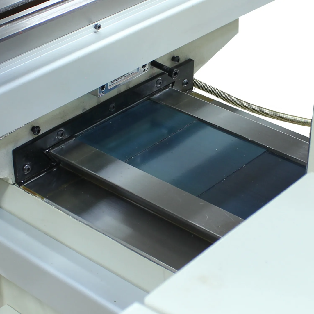 Precision-ground worktable of the Baileigh Vertical Knee Mill - VM-942E-1 1020695 with T-slots for secure workholding and machining versatility.