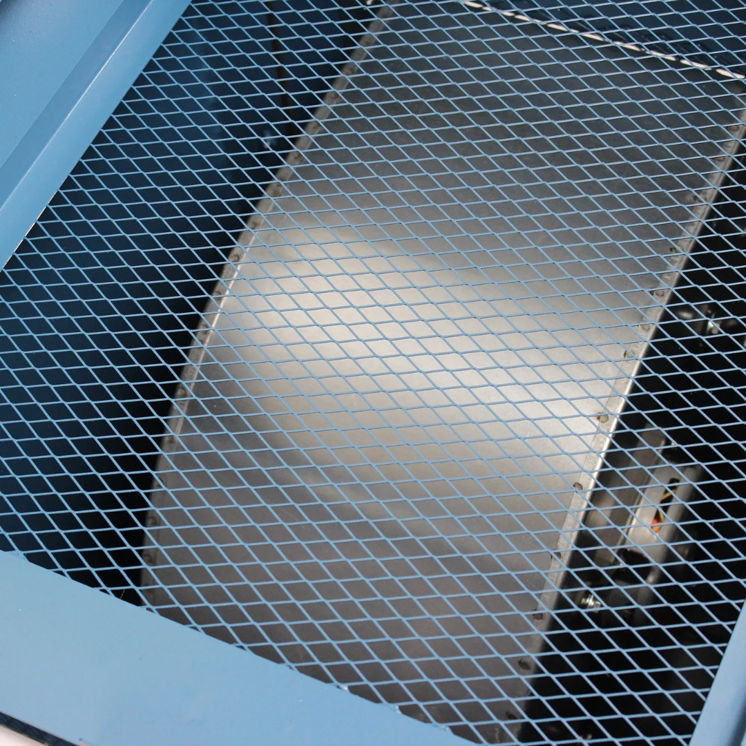Protective mesh screen inside the Baileigh Downdraft Table DDTM-8024 1008628 designed to safeguard internal components and optimize airflow.