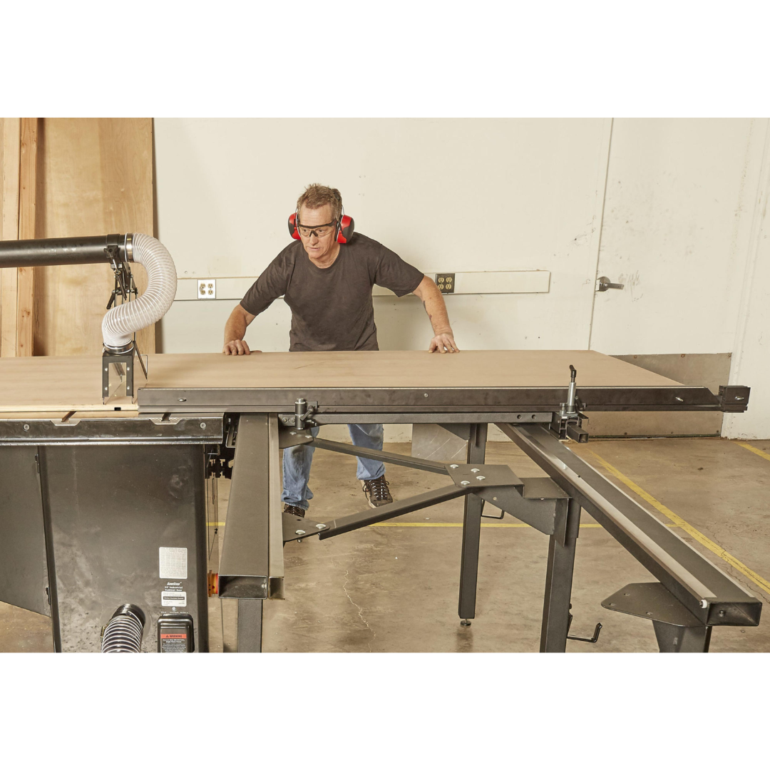 SawStop Large Sliding Table TSA-SA70 in workshop use handling large sheet goods, providing smooth sliding action and enhanced cutting control for woodworking applications.