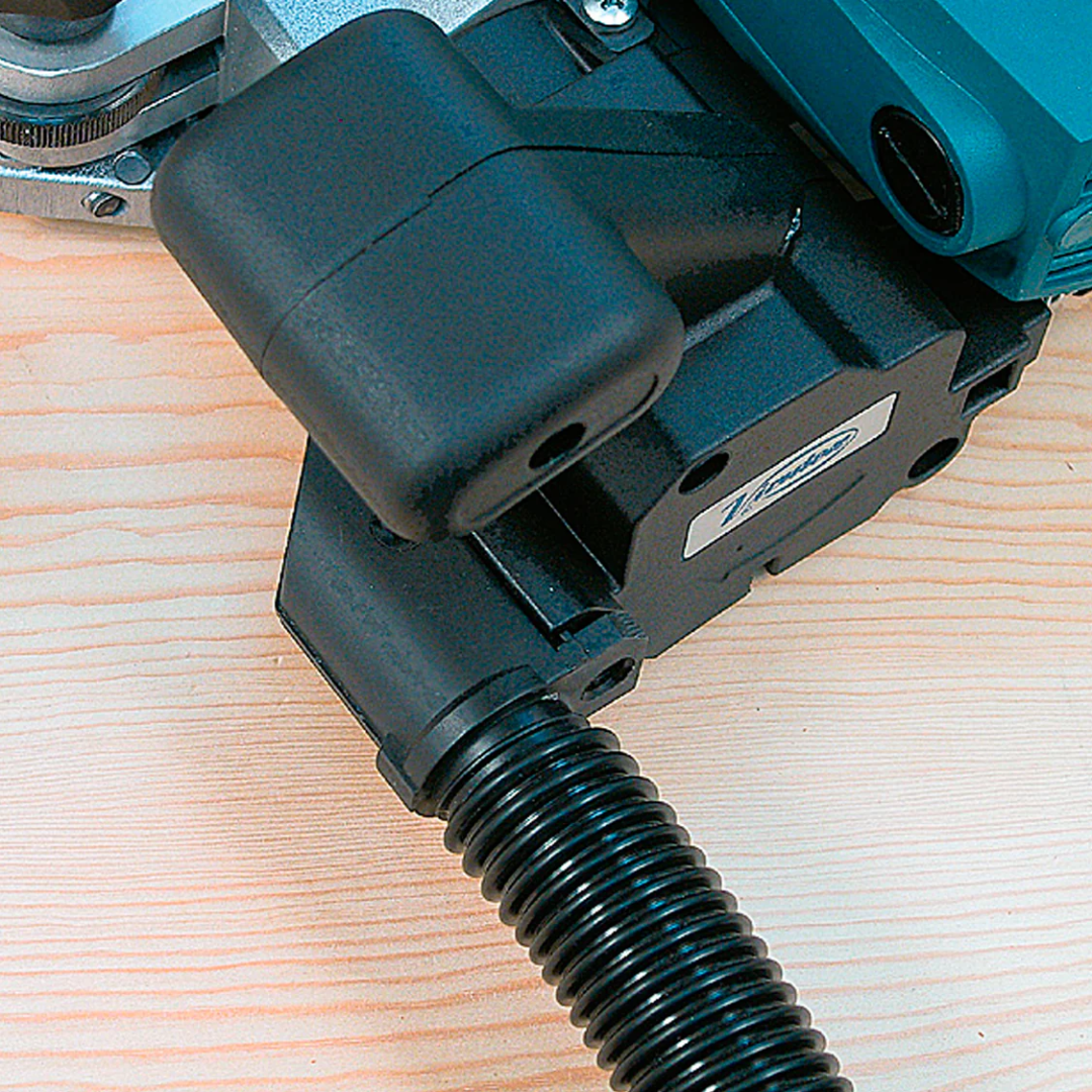 Virutex CE53S Edge Lipping Planer for Perfect Flush Edges 5300199 operator using planer with dust extraction hose for clean working environment