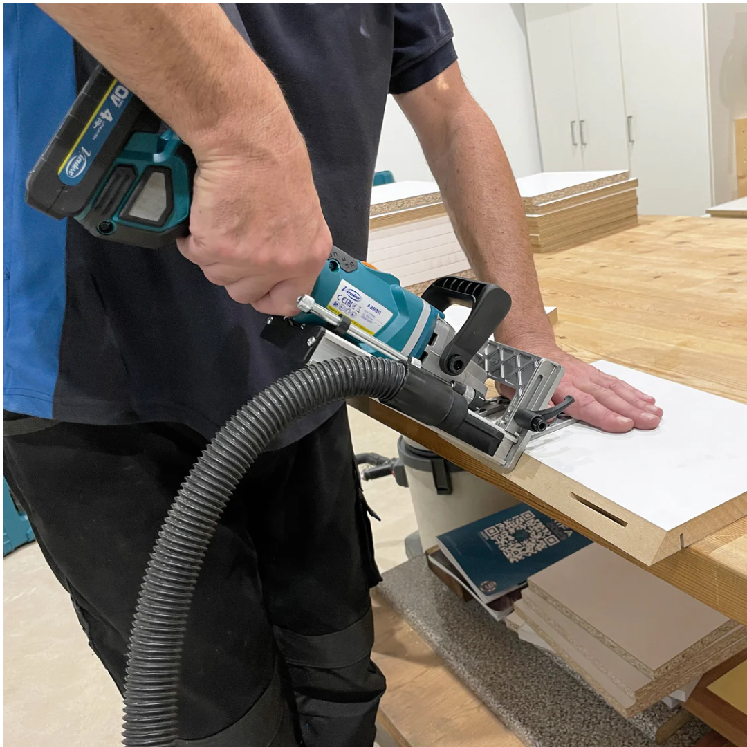 Virutex Cordless Biscuit Joiner ABB311 (Set) 7900301 in use grooving wood panel with dust extraction connected