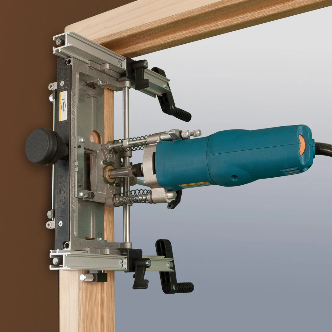 Virutex Router For Fitting Hinges FR129VB (120V) 2900815 in use routing hinge recess on door frame demonstrating precise alignment and clean cuts.