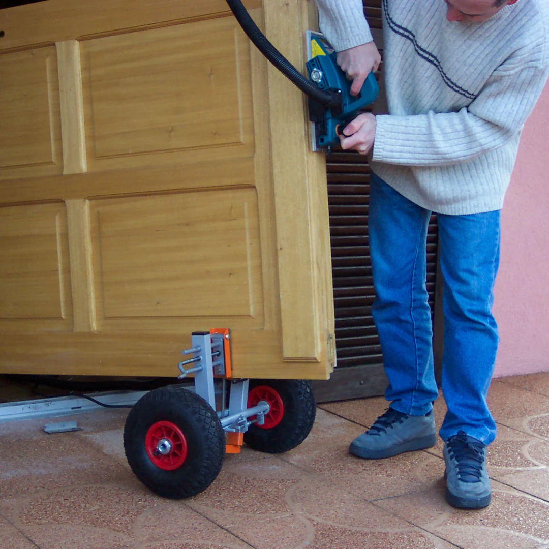 Virutex SPR770T Clamping Dolly For Door Panels: Easy Mobility 7000700 operator maneuvering door panel with ergonomic handle control.