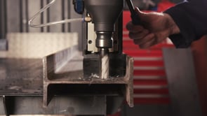 Evolution Power Tools 1-1/8 in. Magnetic Drill With Carry Case S28MAG drilling through structural steel plate, demonstrating precise annular cutter performance for fabrication, construction, and industrial metalworking.