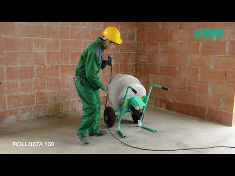 IMER WHEELMAN II - Portable 5CF Wheelbarrow Style Mixer in active jobsite operation mixing concrete inside masonry construction area