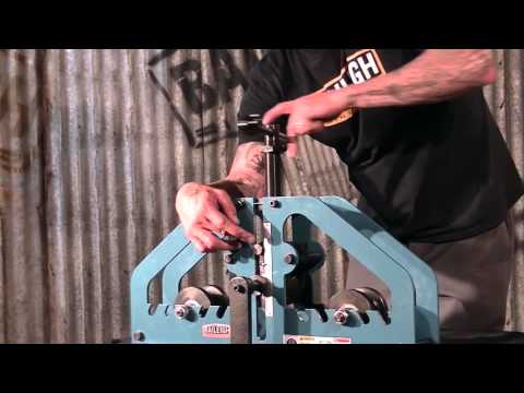 Operational view of the Baileigh Radius Bender - (R-M7) 1006861 demonstrating manual bending of metal material for curved fabrication applications.