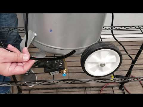 California Air Tools 220V AUTO DRAIN VALVE WITH PLUG EZ-2301-PC installed on air compressor tank demonstrating automatic condensate drainage