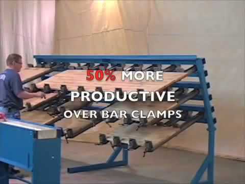 JLT #79F-6-PC 6′ Panel Clamp in production environment with operator assembling wood panels using multi-clamp system