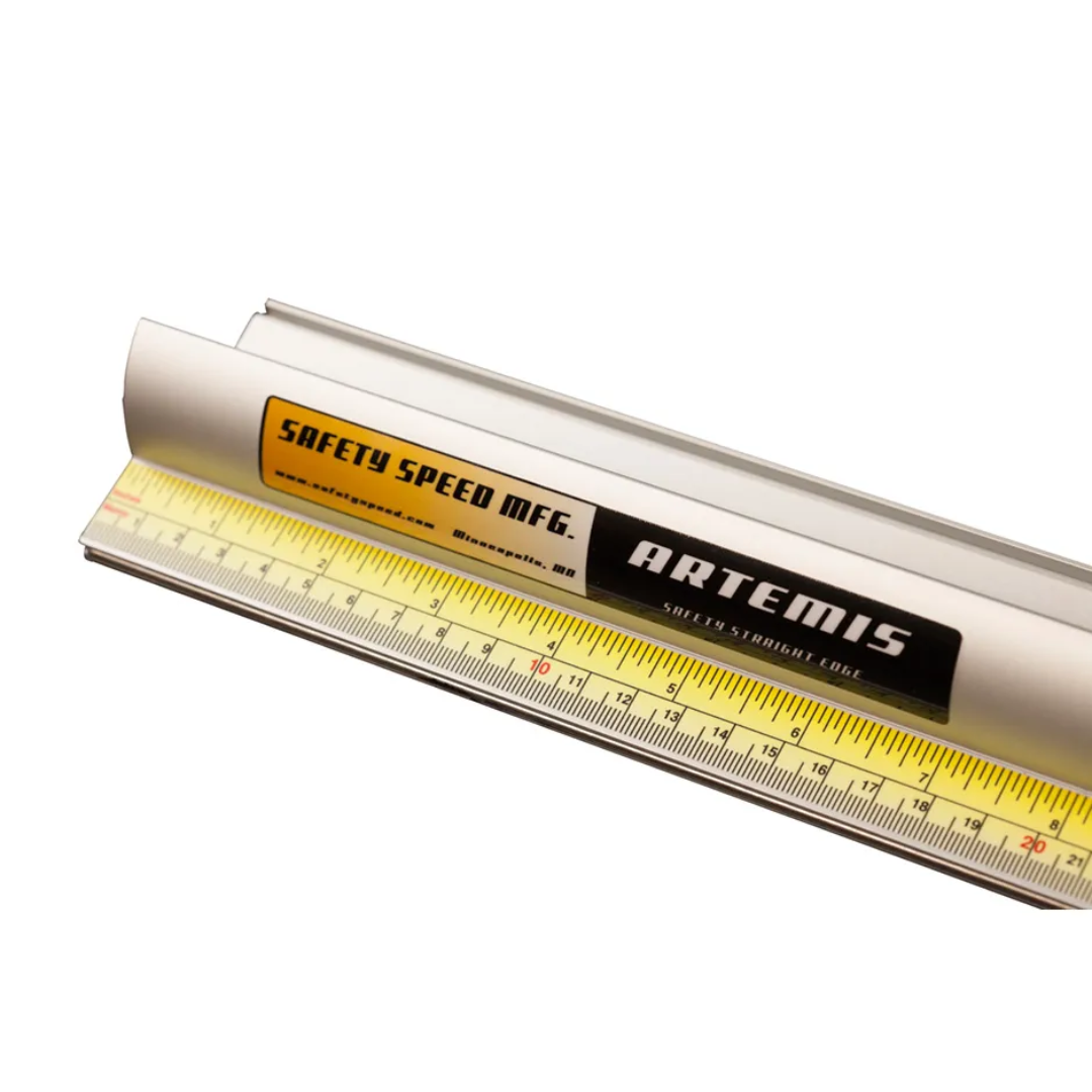 Angled view of Safetyspeed Artemis Safety Straight Edge Ruler displaying durable construction and clear metric scale for accurate cutting guidance.