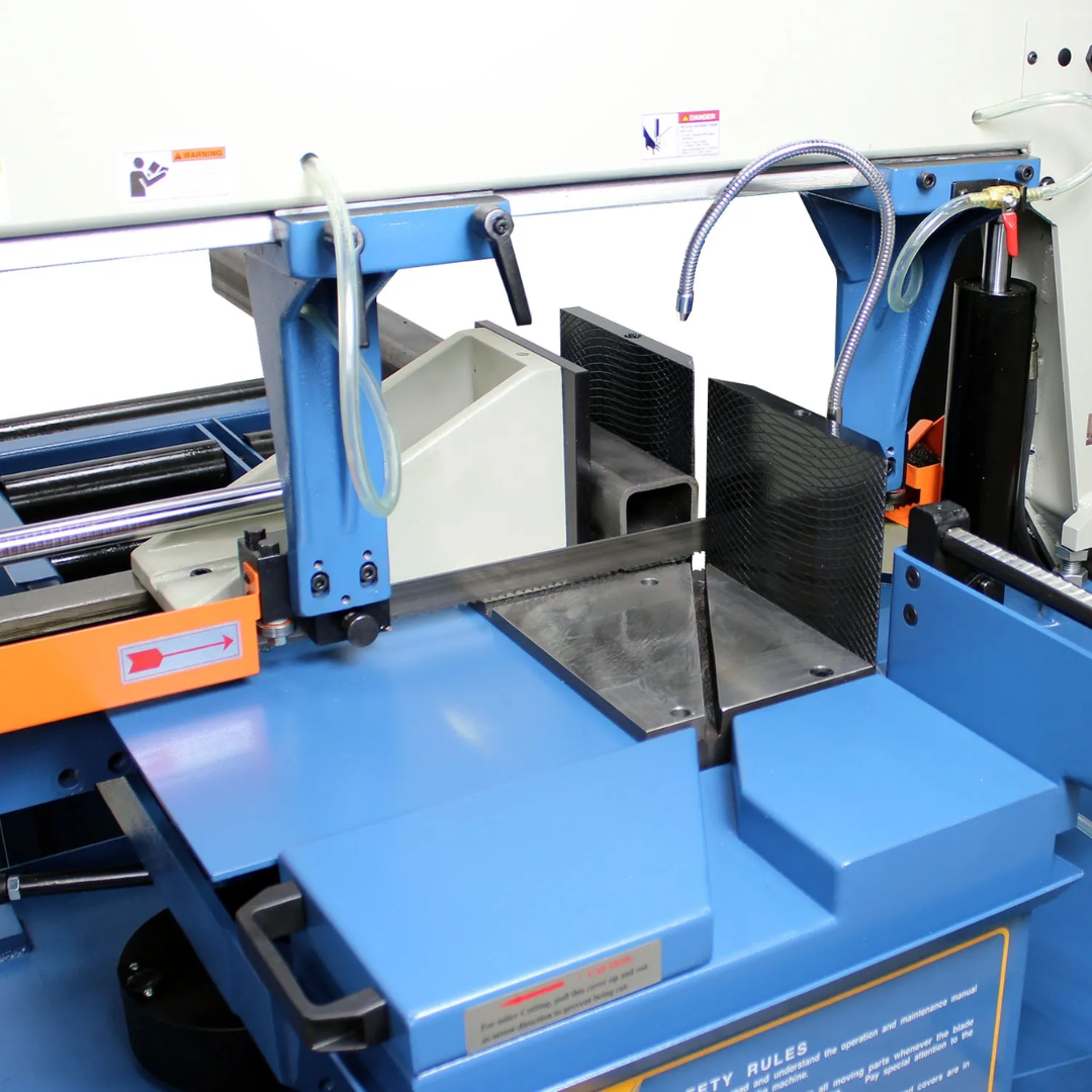 Angled view of the cutting area on the Baileigh 13-Inch Dual-Mitering Semi-Automatic Bandsaw (BS-20SA-DM) 1001298 showing the hydraulic vise, blade guides, and spacious worktable for accurate structural metal cutting.
