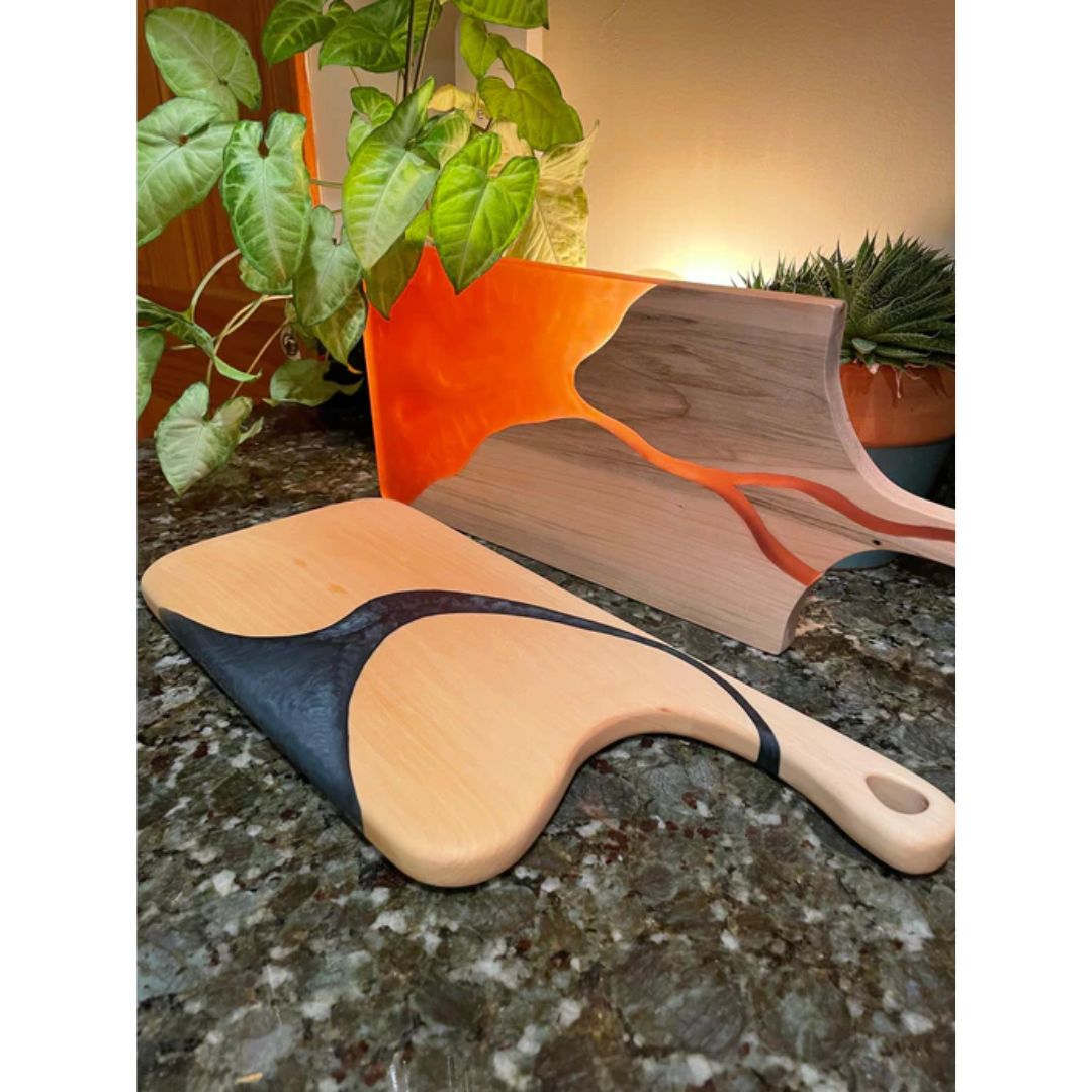 Artistic epoxy wood board submerged in colored resin using Ecopoxy FlowCast SPR Premium Casting Epoxy.