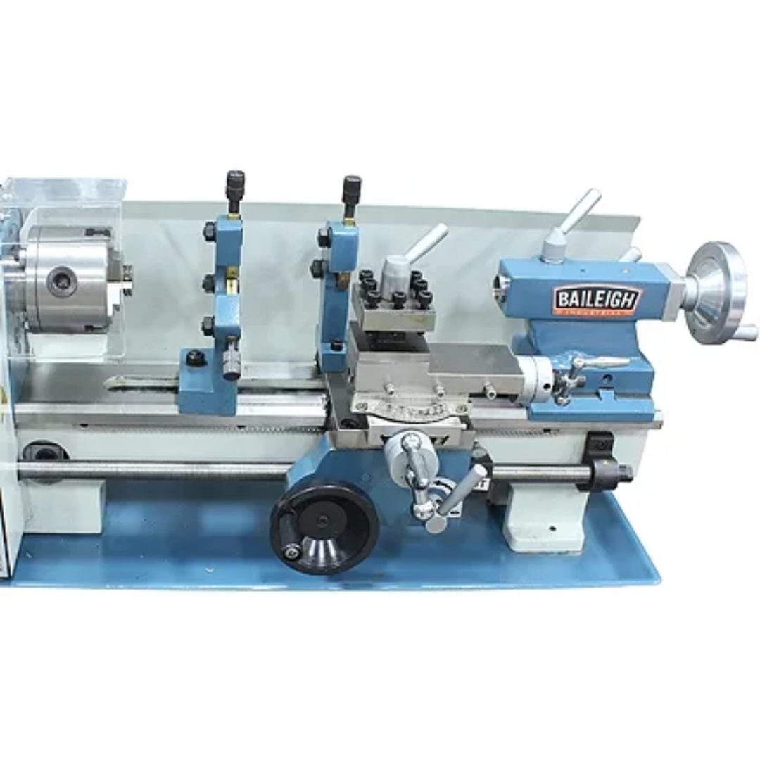 Baileigh Bench Top Lathe (PL-714VS-V2) 1228214 precision metal lathe showcasing the complete workstation layout with chuck, carriage, cross slide, and tailstock designed for turning, threading, and facing operations.