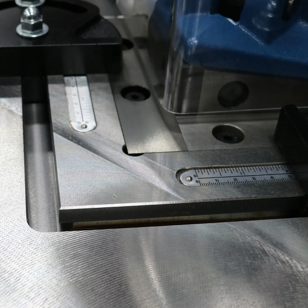 Baileigh Corner Notcher SN-F11-AN 1007236 precision work surface with adjustable material guides for repeatable sheet metal notching and fabrication.