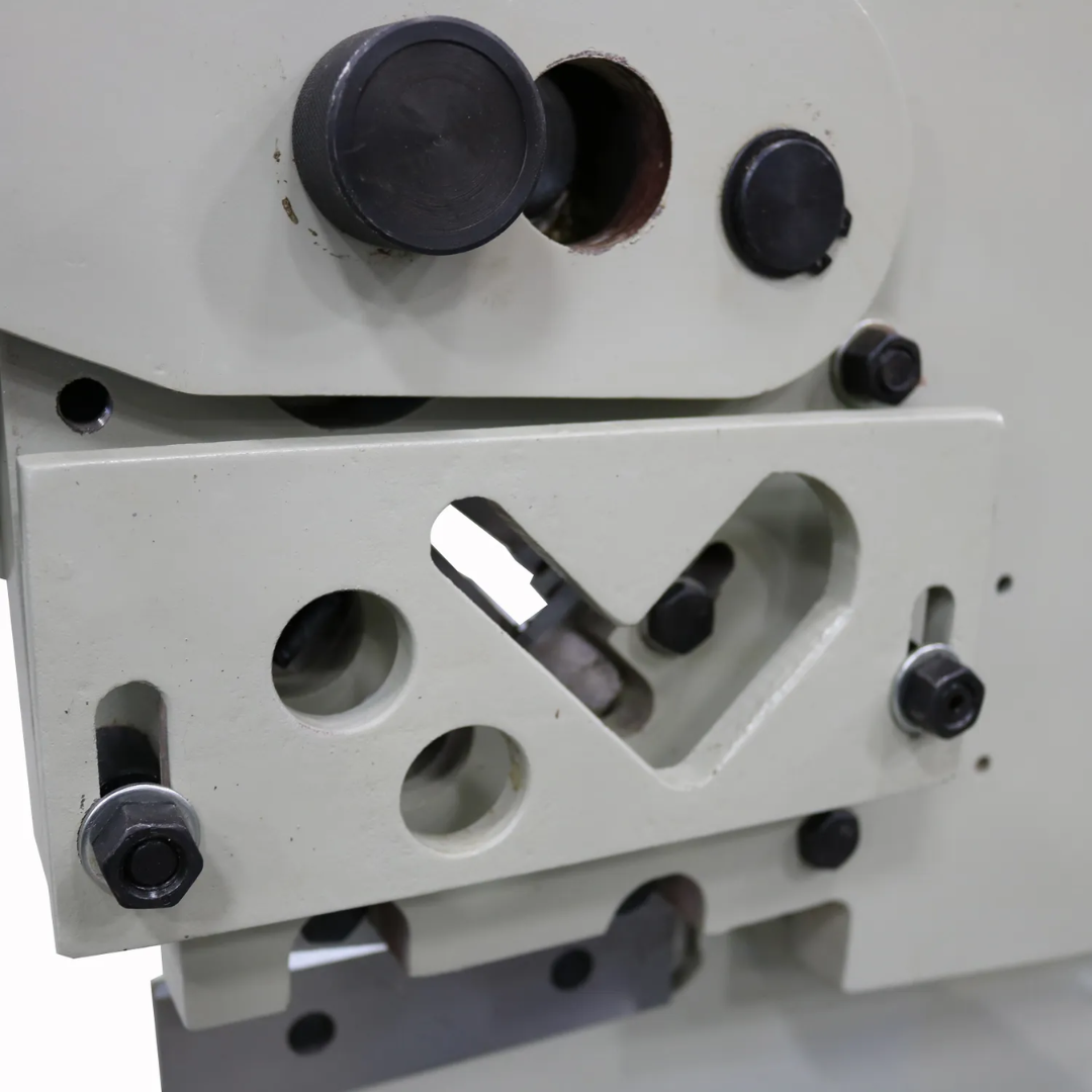 Baileigh Manual Ironworker SW-22M 1007741 close-up of the multi-purpose tooling station designed for flat bar, angle iron, and rod cutting operations.