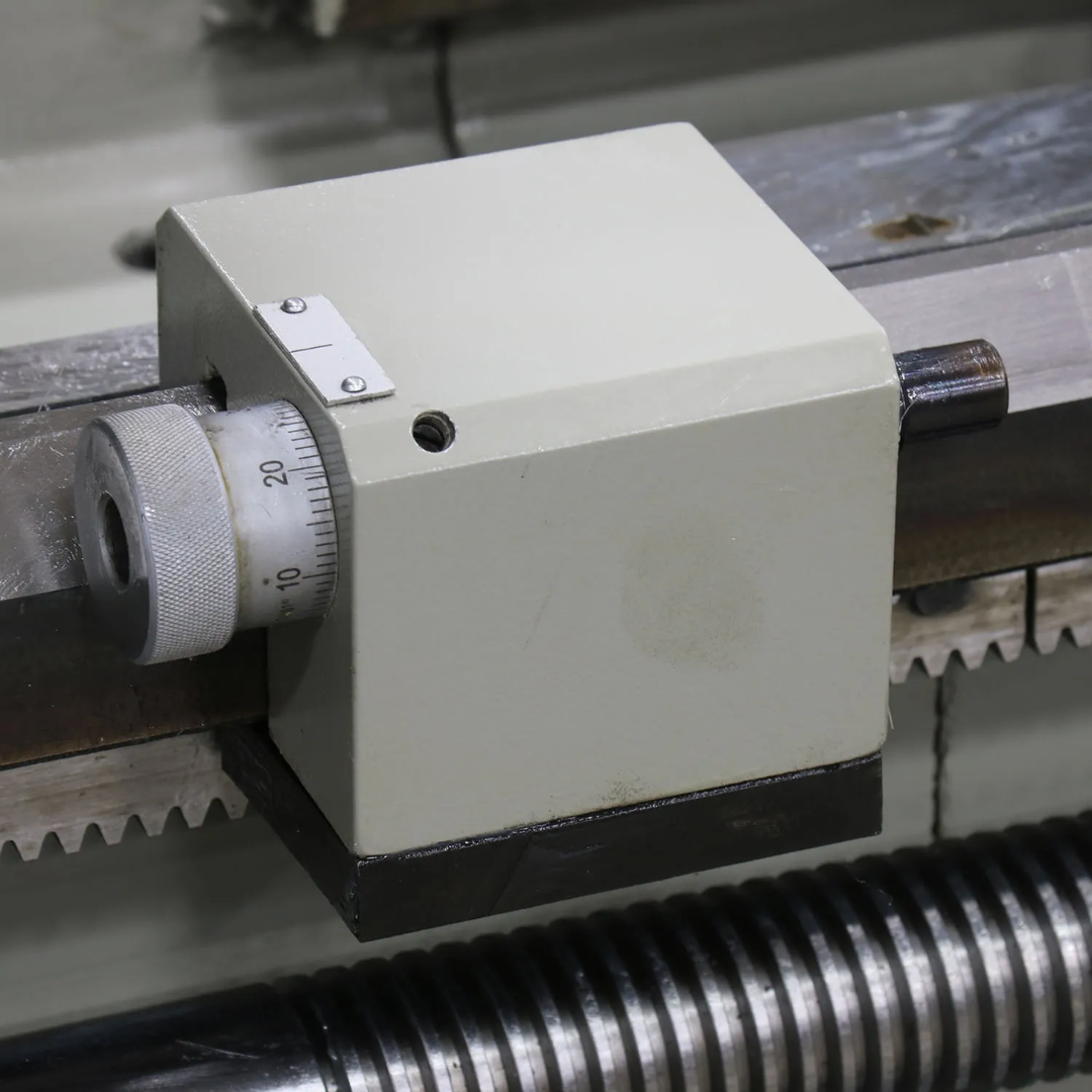 Baileigh Metal Lathe - PL-1860E 1016624 lead screw and carriage assembly designed for smooth automatic feed and precision threading operations.