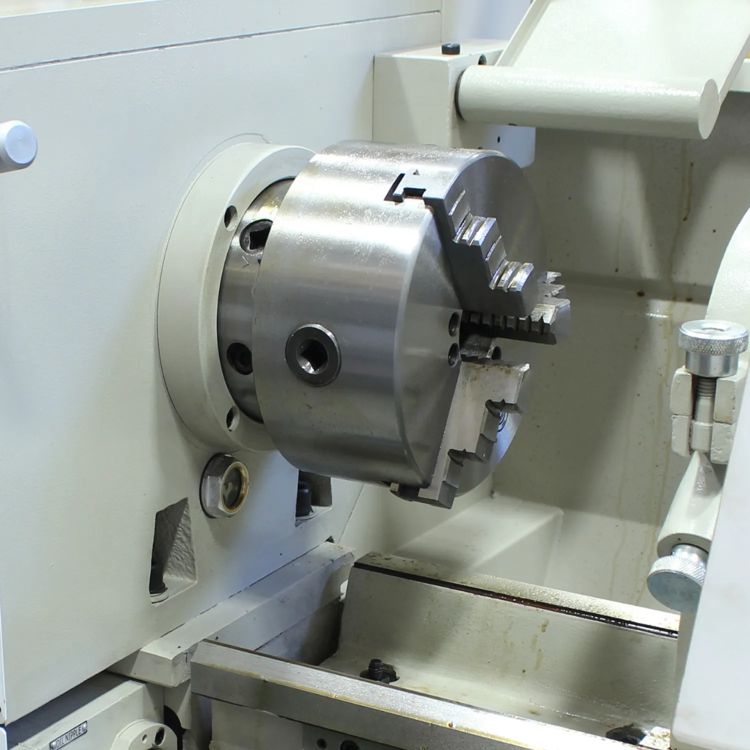 Baileigh Metal Lathe PL-1236E 1016616 close-up of the spindle and chuck assembly designed for secure workpiece holding, accurate rotation, and precision machining performance.