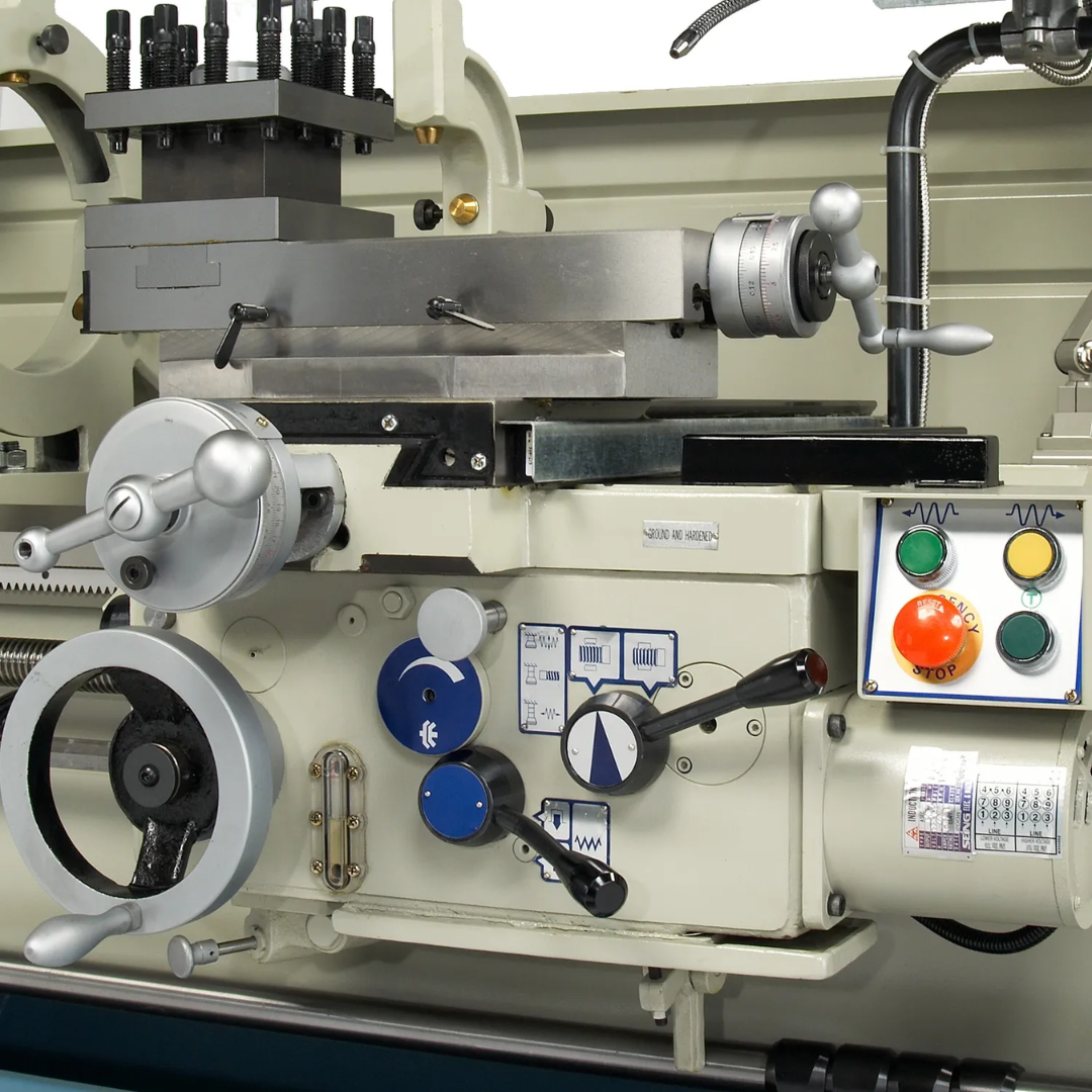 Baileigh Precision Metal Lathe PL-2080 1006176 carriage handwheels, feed controls, and emergency stop controls designed for precise and safe lathe operation.