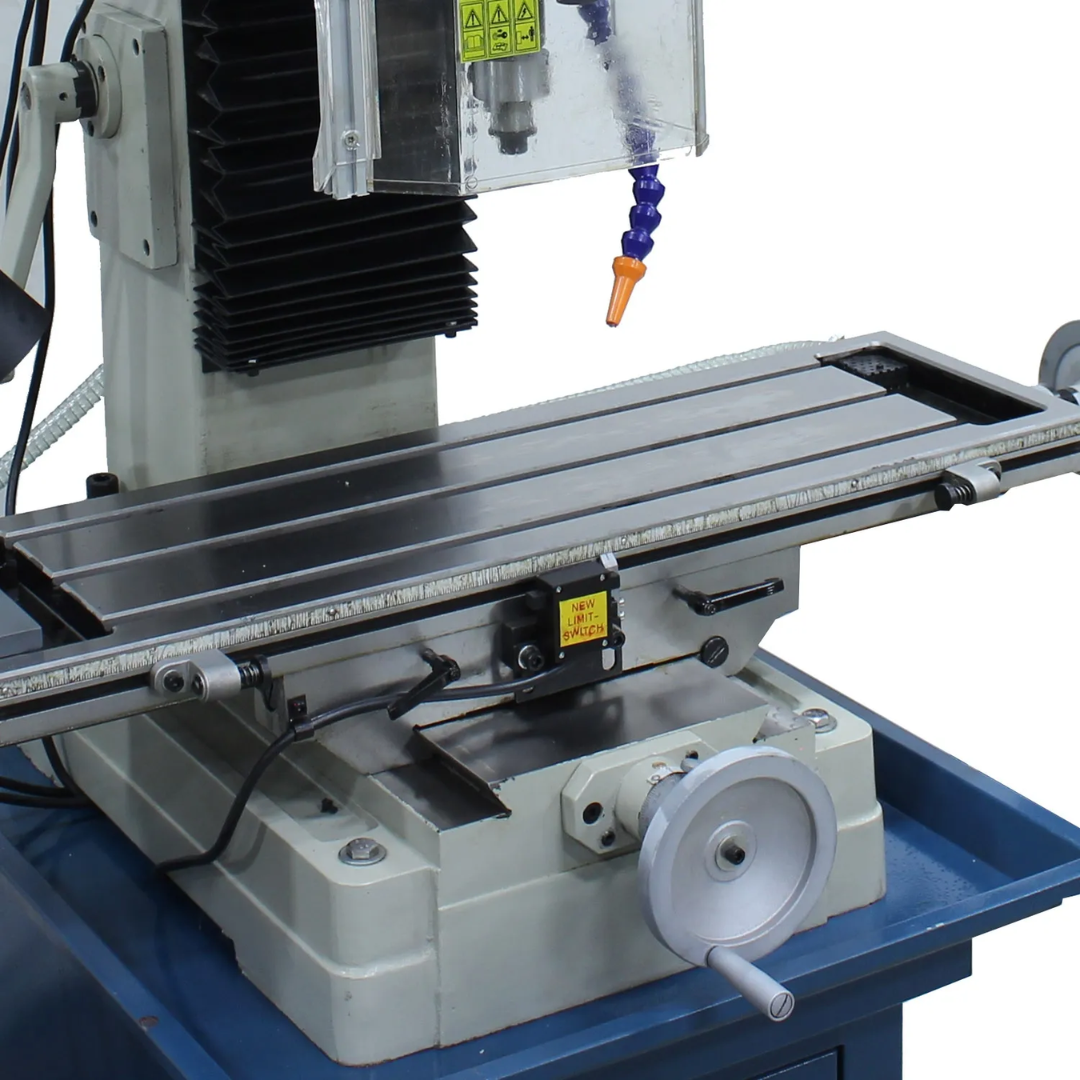 Baileigh Vertical Mill Drill (VMD-931G) 1020693 close-up of the precision-machined worktable with handwheel controls and T-slot surface for accurate workpiece positioning and milling operations.