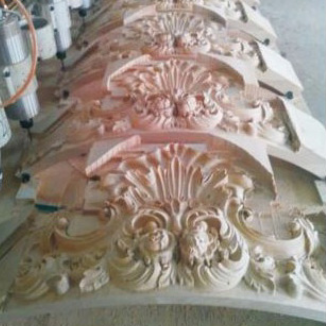 Decorative wooden panel with Castaly CNC Carving Machine intricate carvings on a workbench.