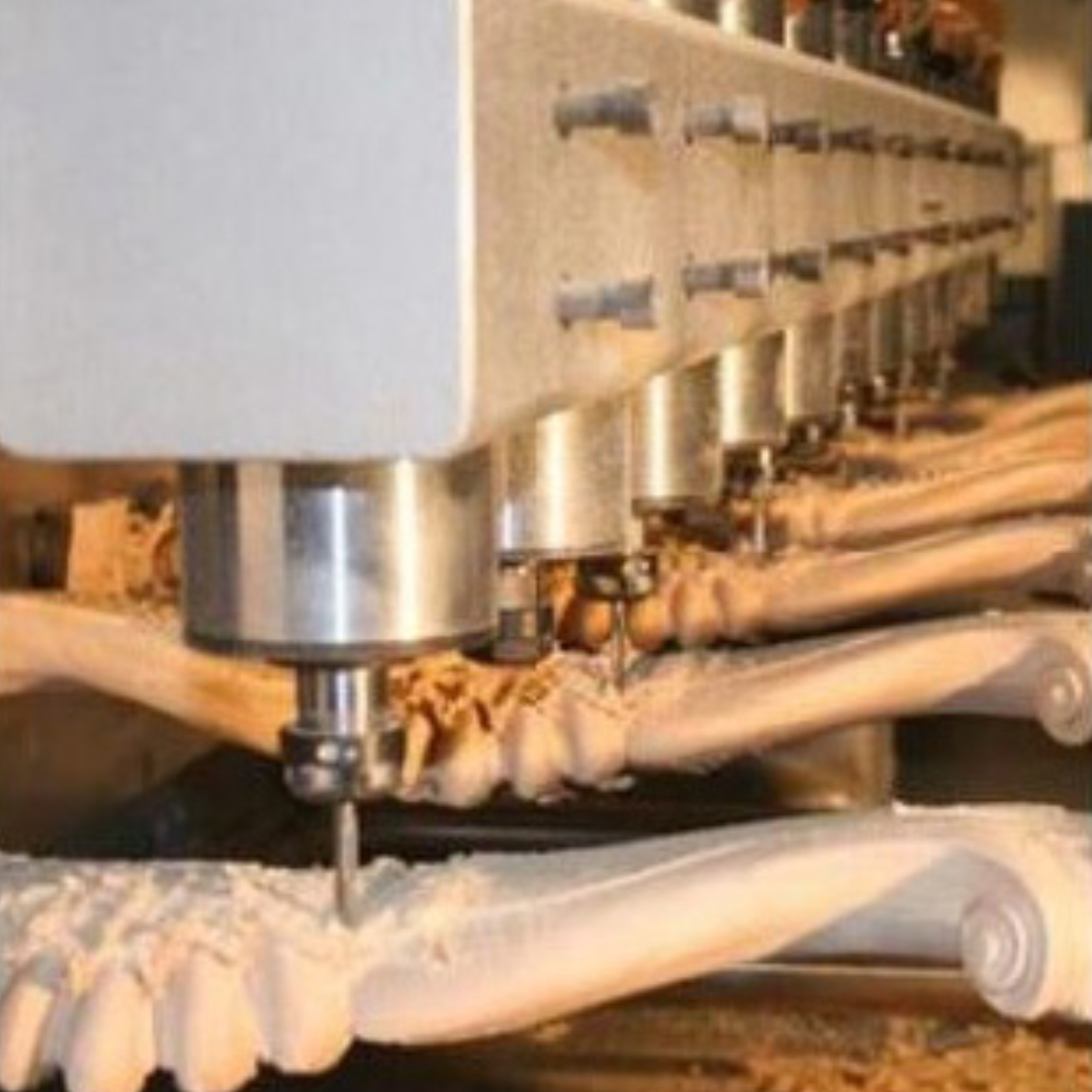 Woodworking machine CNCCarvingMachine_RT-CAV_Example3 with multiple drill bits in action on a wooden surface.