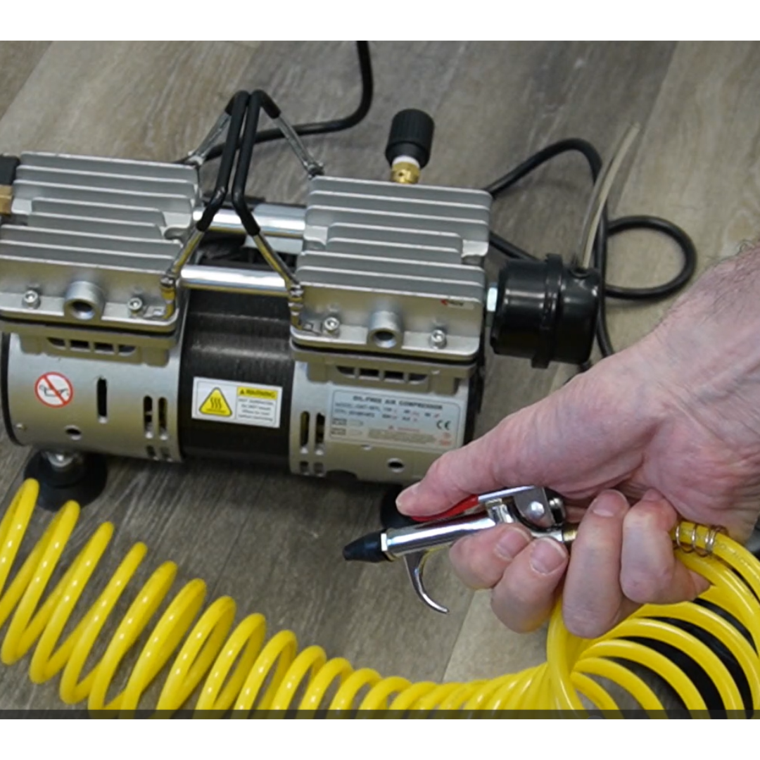 California Air Tools 10TL Ultra Quiet 1.0 Hp Oil-Free Tankless Air Compressor in use with air hose connected for light duty applications