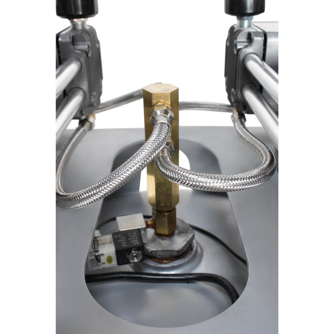 California Air Tools 80060C Powerful 6.0 Hp Ultra Quiet & Oil-Free 80 Gallon Stationary Air Compressor close-up of internal tank outlet and fittings