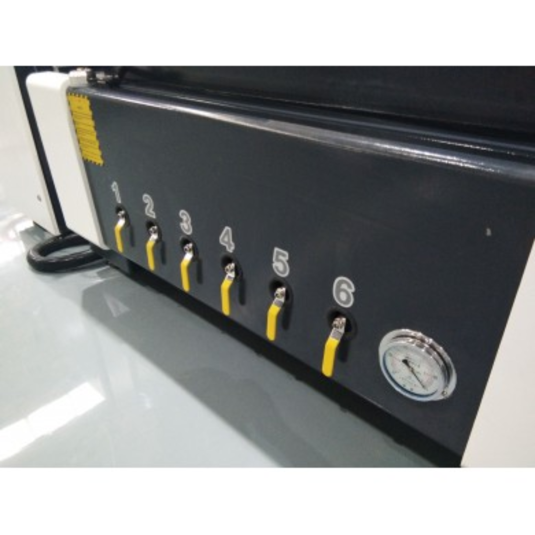 Castaly Basic CNC Router vacuum table detail showing multi-zone hold-down system with adjustable suction ports for secure material positioning.