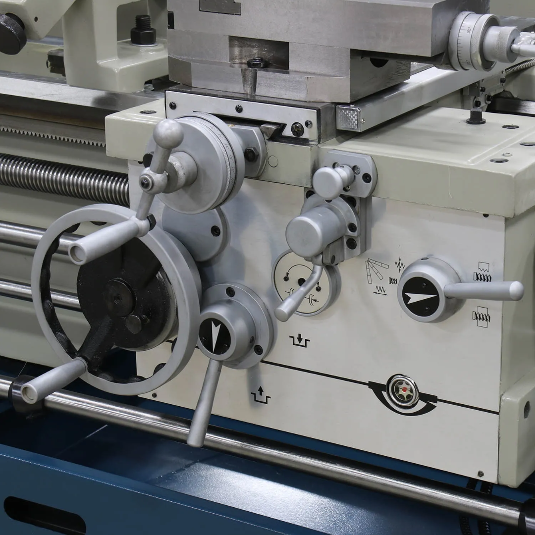 Close-up of the Baileigh Metal Lathe - PL-1860E 1016624 carriage, cross slide, and compound rest engineered for precise turning, threading, and facing operations.