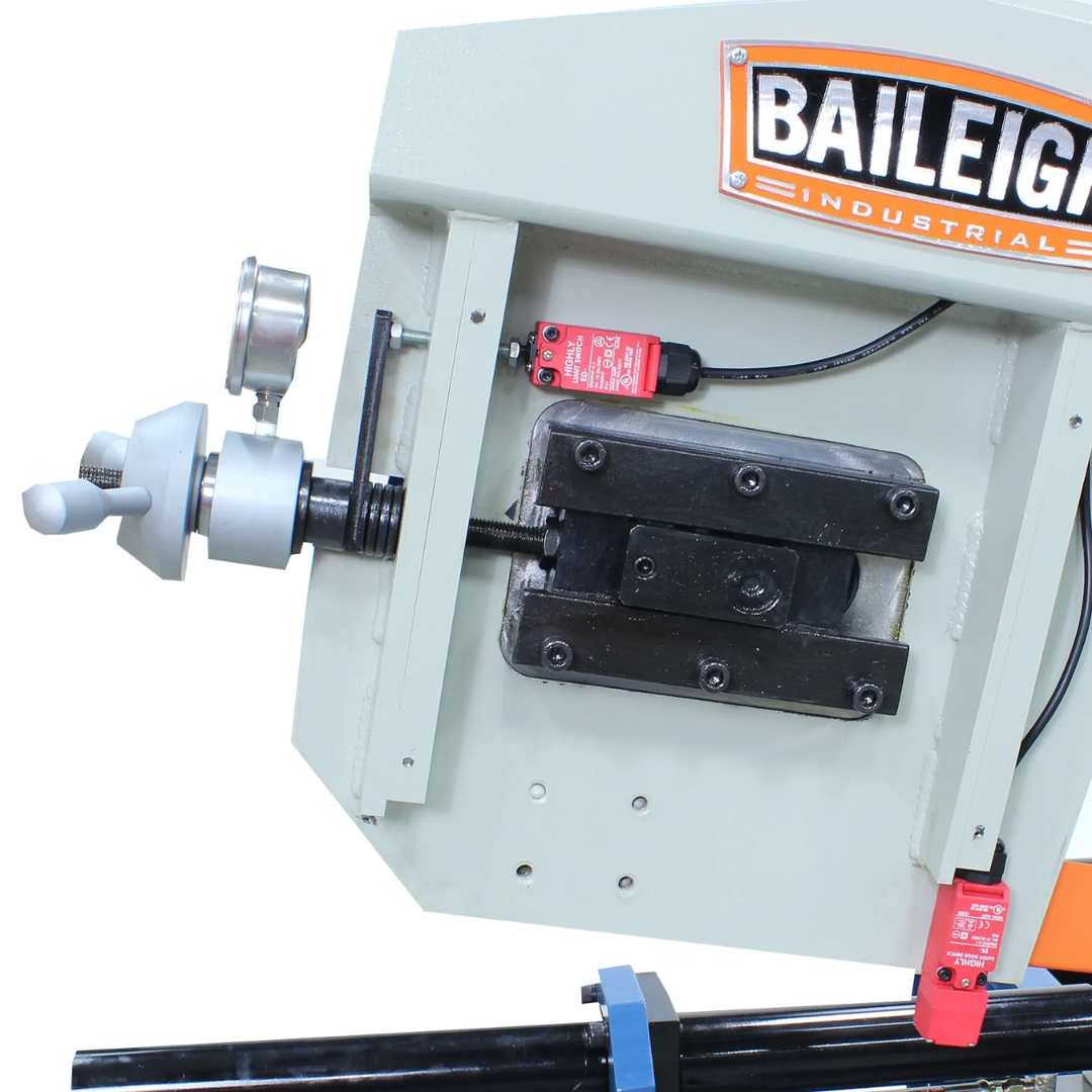 Close-up of the blade tension adjustment assembly on the Baileigh 13-Inch Dual-Mitering Semi-Automatic Bandsaw (BS-20SA-DM) 1001298 featuring the precision tensioning mechanism and industrial bandsaw housing.
