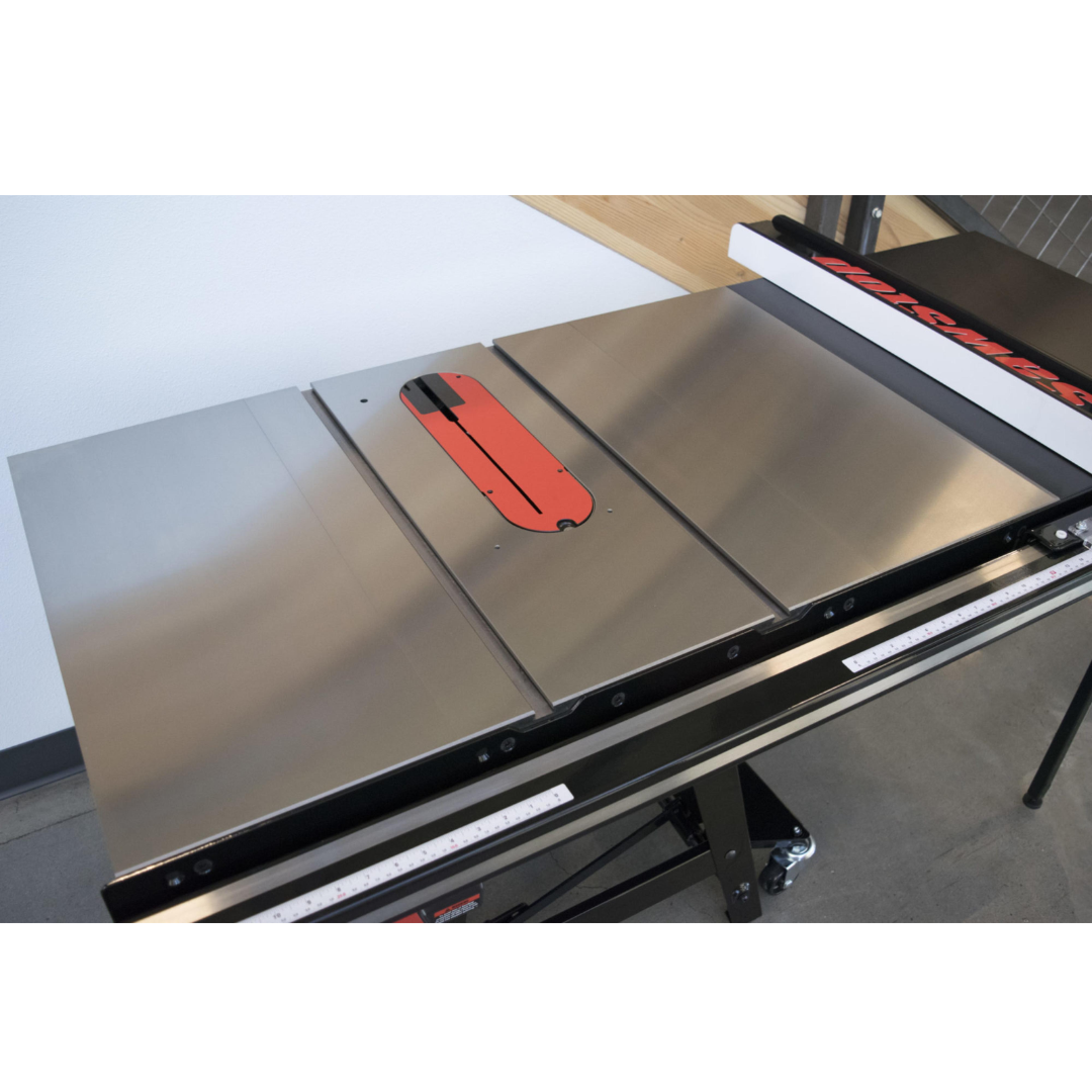 Close-up view of SawStop Two Cast Iron Wings CNS-CIWA mounted alongside a table saw top, showcasing the precision-machined cast iron surface and seamless integration.