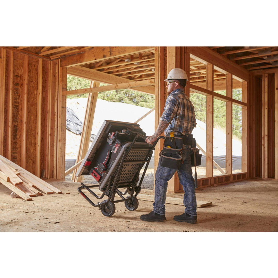 Contractor transporting the SawStop Jobsite Saw Pro across a construction site using the built-in mobile cart system.